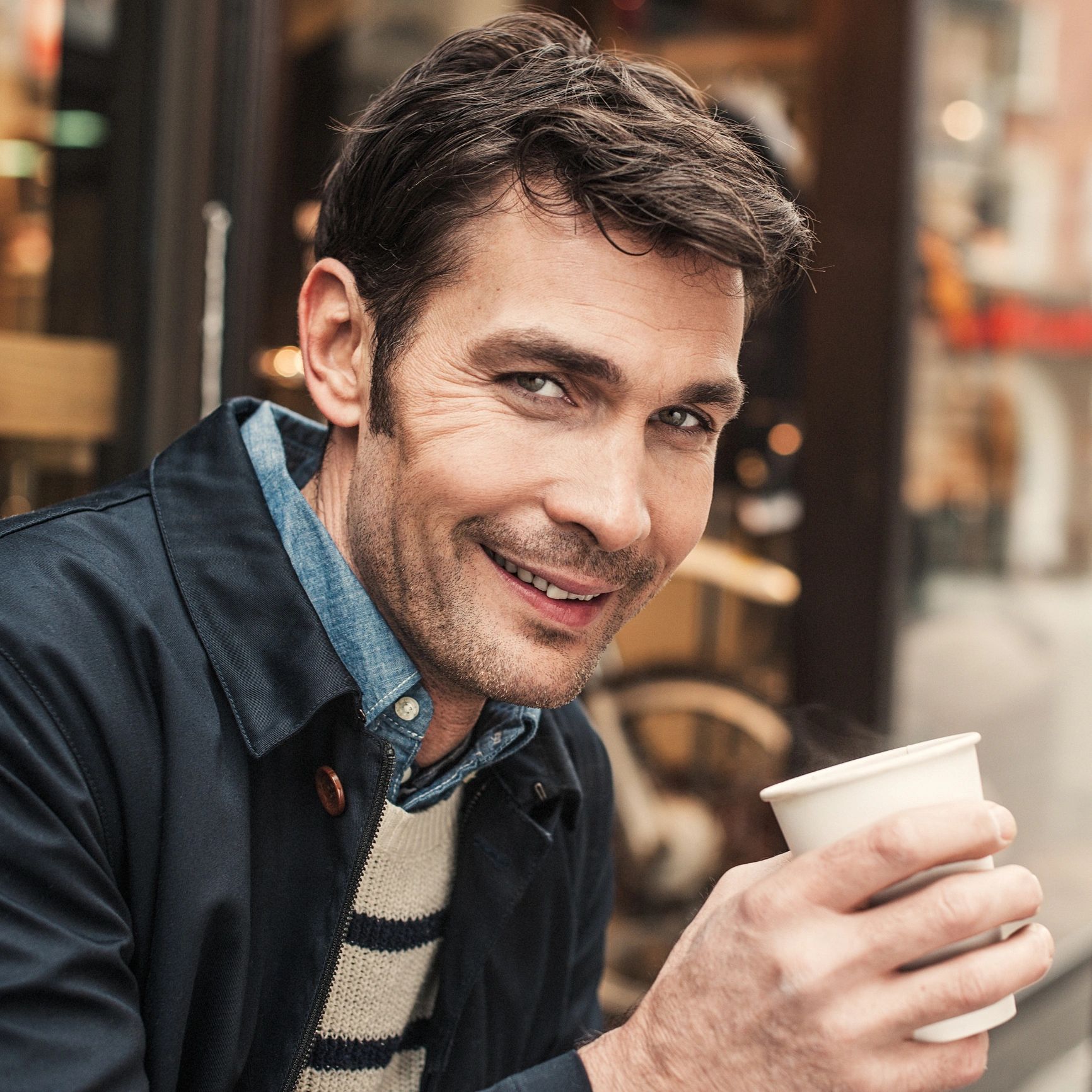 Customer enjoying coffee outside a cafe